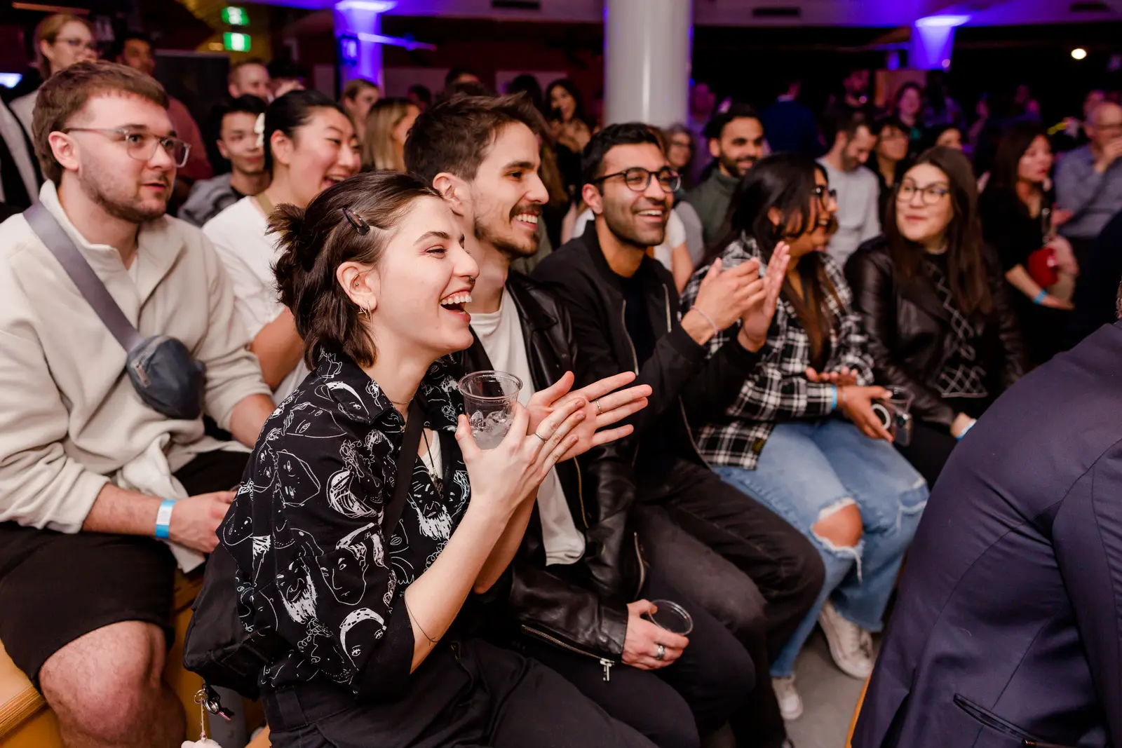 Audience watching a performance at a previous Science World After Dark event, shown here as an illustrative example of the venue's evening programming.